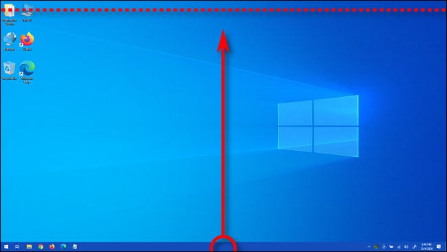 Con la barra de tareas desbloqueada, arrástrela con el mouse hasta la parte superior de la pantalla y suelte el botón del mouse.